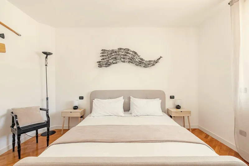 Second bedroom: double bed with grey headboard